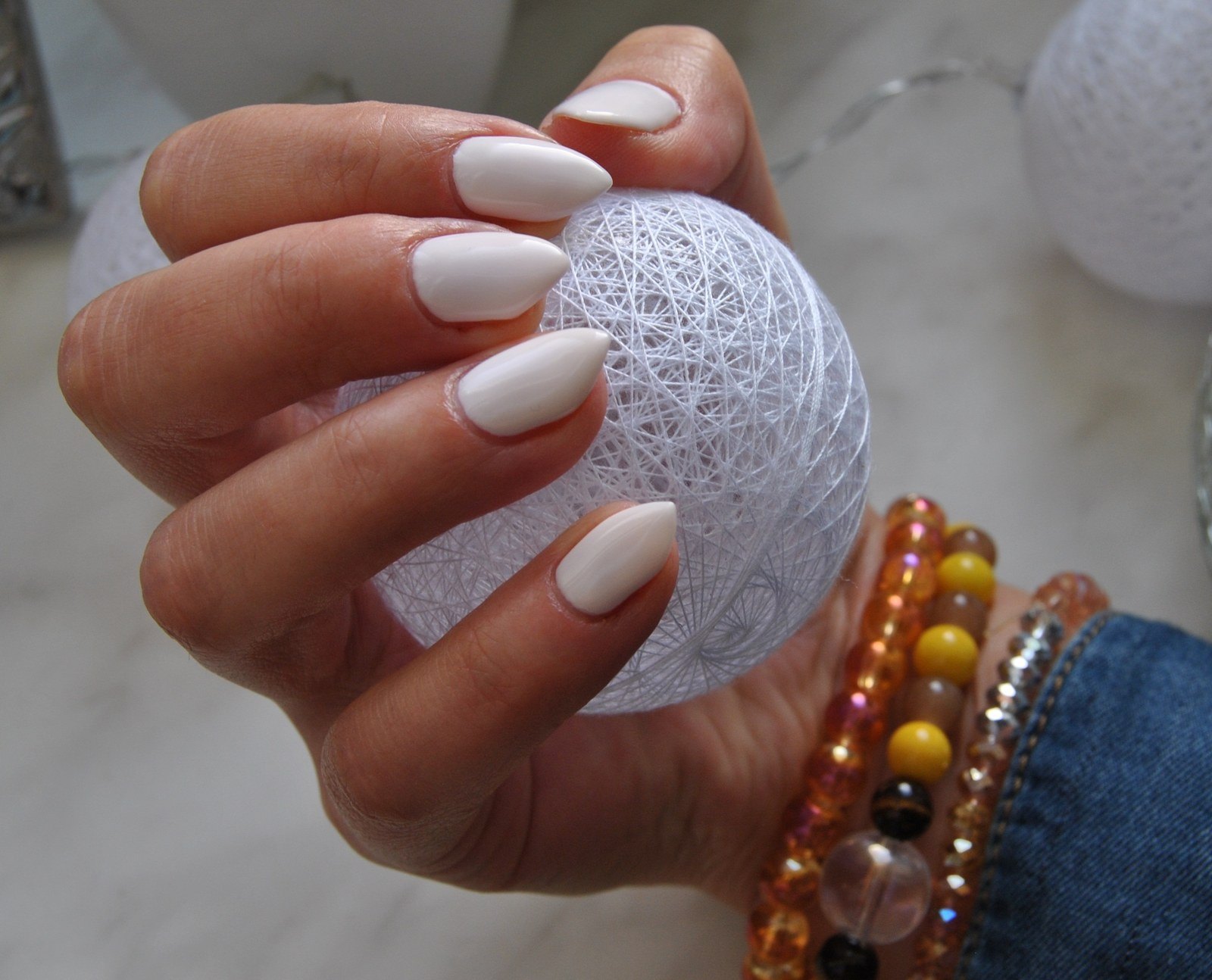 A soft white almond set, built up and filed to a point