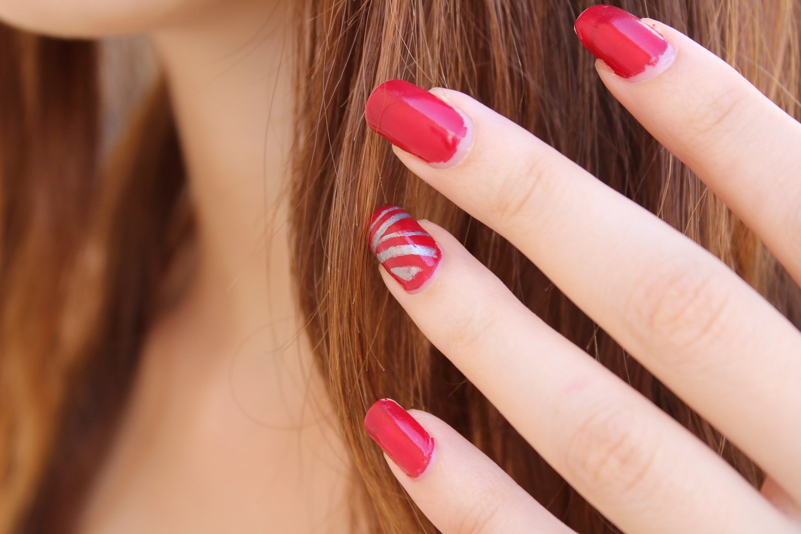 Red with a single silver nail, which is usually enough