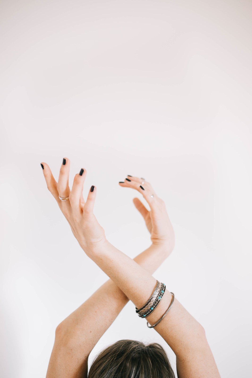 Black on a raised hand, because nails are worn, not displayed