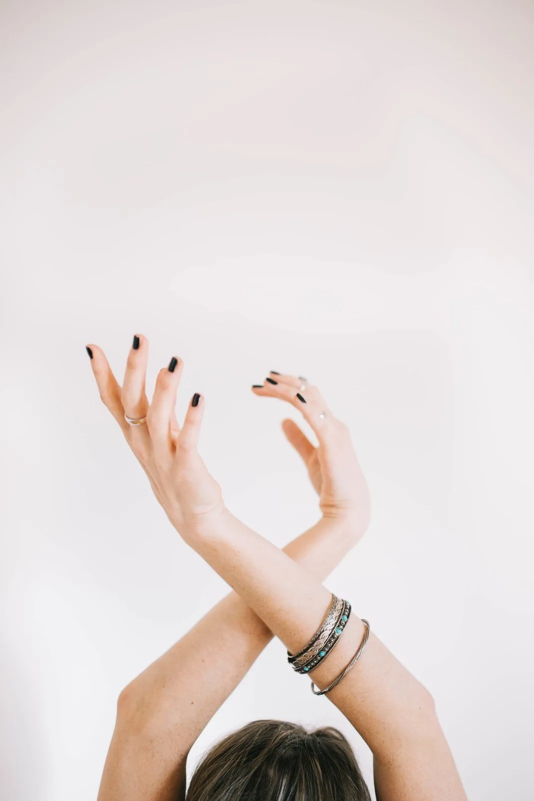 Black on a raised hand, because nails are worn, not displayed