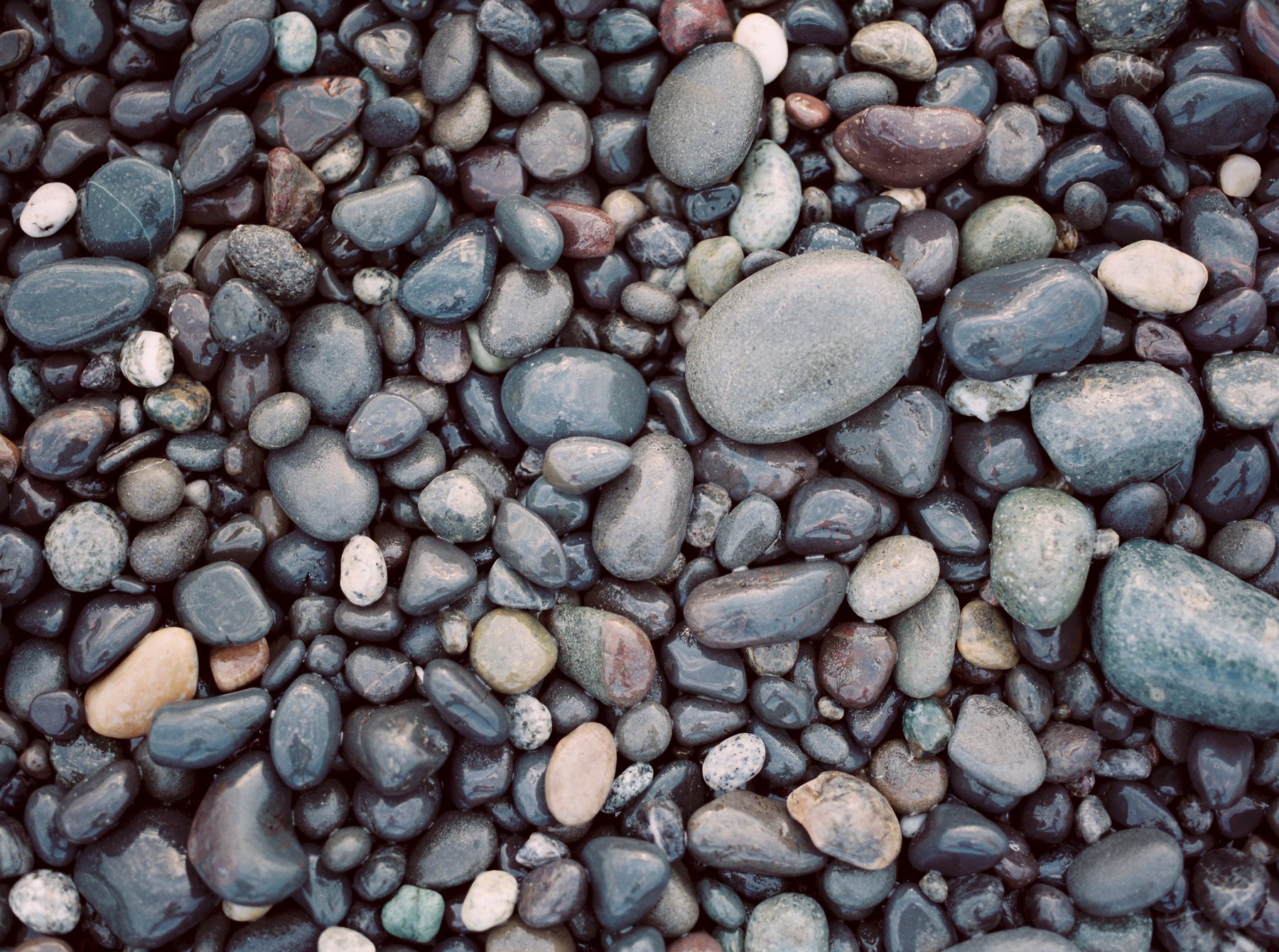 River stones, sorted by size and warmed in water